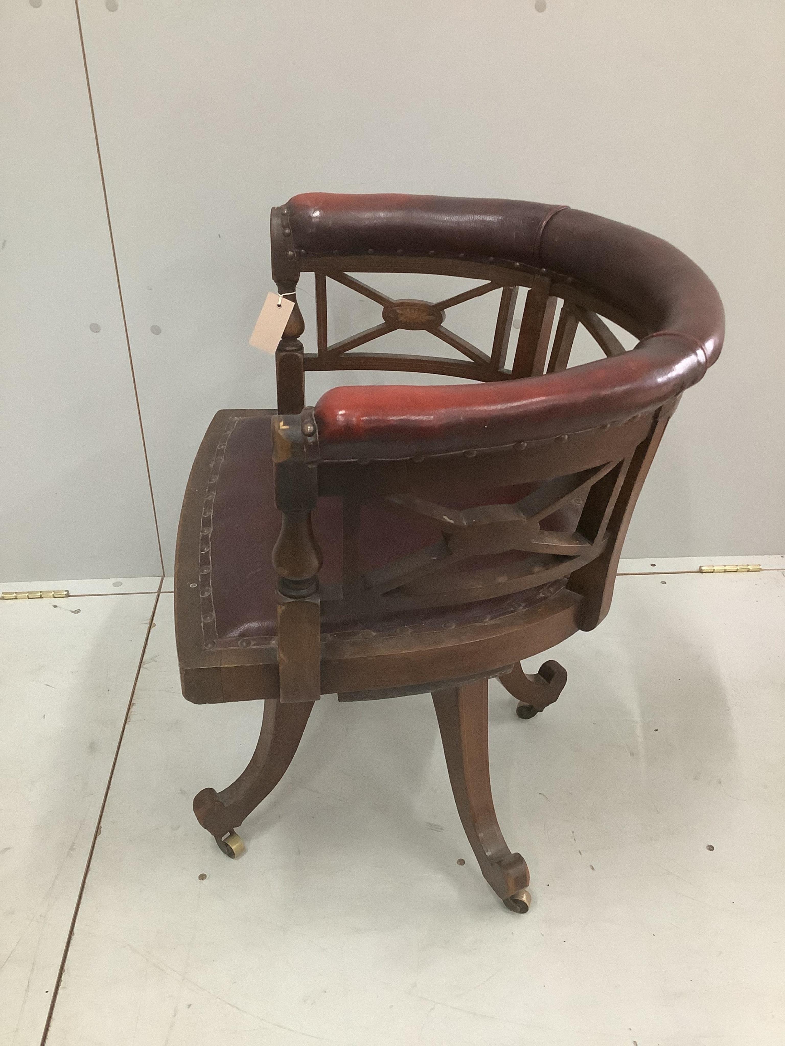 An Edwardian inlaid mahogany leather swivel desk chair, width 65cm, depth 48cm, height 68cm. Condition - poor to fair